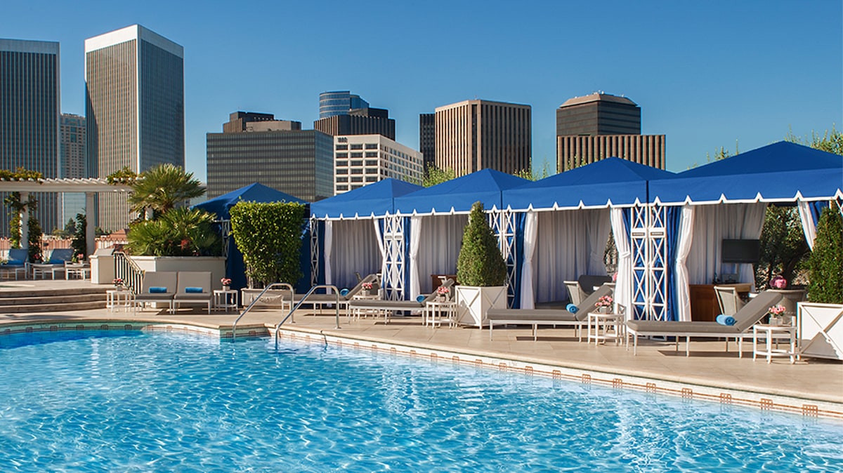 rooftop pool with blue cabanas peninsula beverly hills